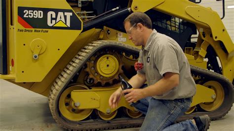 skid steer track maintenance|cat skid steer oil level.